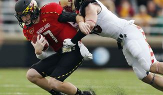 Boston College linebacker Tim Joy (33) tackles Maryland quarterback Caleb Rowe (7) on a carry in the fourth quarter of an NCAA college football game in Boston, Saturday, Oct. 27, 2012. Boston College won 20-17. (AP Photo/Michael Dwyer)