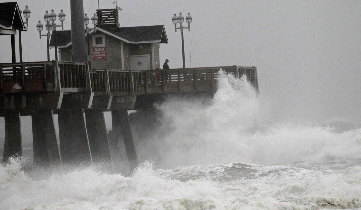 Large waves generated by Hurricane Sandy crash into Jeanette&#x27;s Pier in Nags Head, N.C., Saturday, Oct. 27, 2012, as the storm moves up the East Coast. (AP Photo/Gerry Broome)

