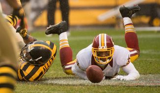 Redskins wide receiver Santana Moss can’t hold onto a fourth-down pass late in the fourth quarter of Sunday’s loss in Pittsburgh. (Andrew Harnik/The Washington Times)