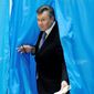 Ukrainian President Viktor Yanukovych cast his ballot Sunday in Kiev. His ruling Party of Regions should have no trouble retaining its majority in parliament, but observers were watching for irregularities in a crucial election that could determine which opposition party would come in second — and which direction the nation would go. (Associated Press)
