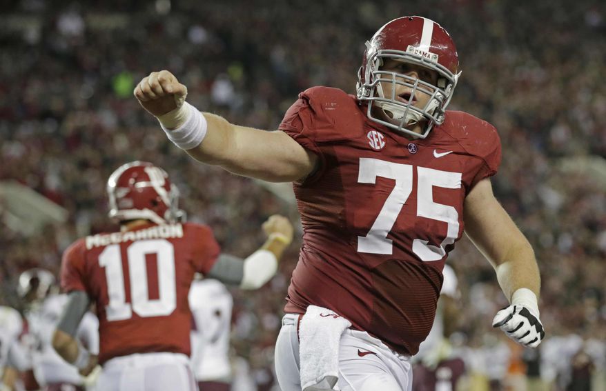 Alabama offensive lineman Barrett Jones (75) and quarterback AJ McCarron (10) react after a touchdown was scored during the first half of an NCAA college football game against Mississippi State at Bryant-Denny Stadium in Tuscaloosa, Ala., Saturday, Oct. 27, 2012. (AP Photo/Dave Martin)