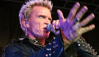Billy Idol performs Friday, Oct. 26, 2012, in Seattle. (AP Photo/Gene Johnson)