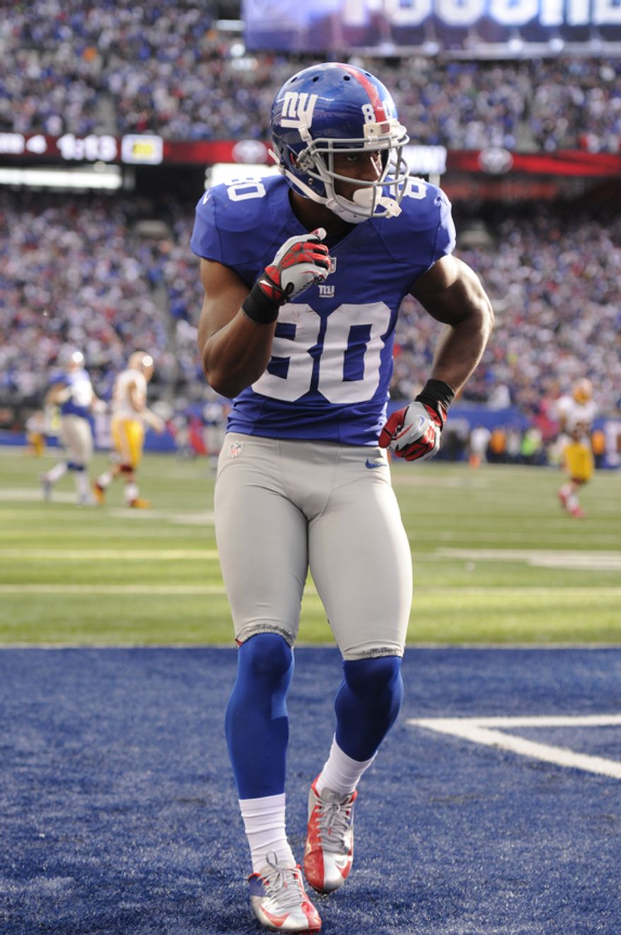 New York Giants wide receiver Victor Cruz (80) performs his celebration salsa dance after scoring a game-winning 77-yard touchdown at MetLife Stadium, East Rutherford, N.J., Oct. 21, 2012. (Preston Keres/Special to The Washington Times)