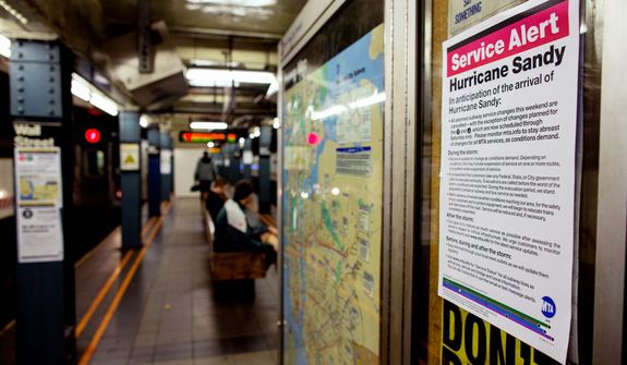 A sign informs subway riders of changes in service in the hours before the arrival of Hurricane Sandy in New York Sunday, Oct. 28, 2012. Areas in the Northeast Region prepared Sunday for the arrival of the hurricane and a possible flooding storm surge. (AP Photo/Craig Ruttle)