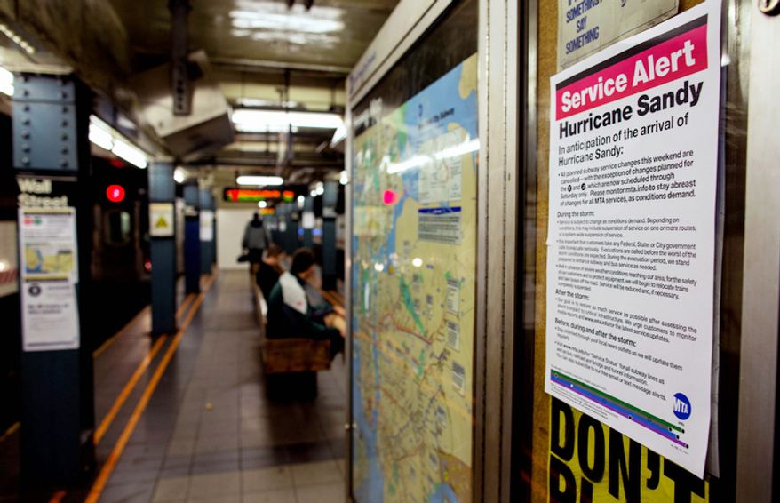 A sign informs subway riders of changes in service in the hours before the arrival of Hurricane Sandy in New York Sunday, Oct. 28, 2012. Areas in the Northeast Region prepared Sunday for the arrival of the hurricane and a possible flooding storm surge. (AP Photo/Craig Ruttle)
