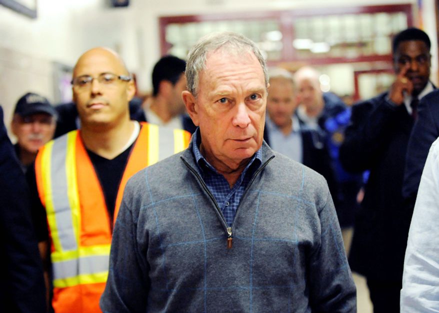 Mayor Michael Bloomberg arrives at Seward Park High School on the lower east side, the site of one of many public shelters set up in preparation of the storm, Sunday, Oct. 28, 2012, in New York. (AP Photo/ Louis Lanzano)