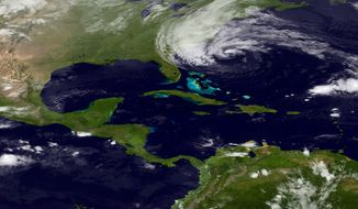 In this image taken by the National Oceanic and Atmospheric Administration&#39;s GOES East satellite on Sunday, Oct. 28, 2012, Hurricane Sandy is seen on the East Coast of the United States. (AP Photo/NOAA)