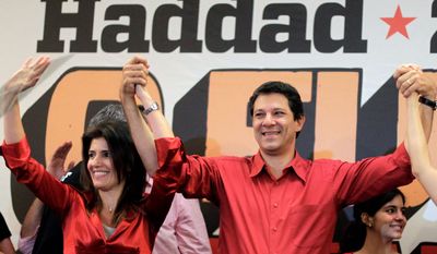 Fernando Haddad, Sao Paulo’s Mayor-elect celebrates accompanied by his wife, Stela Haddad, after winning mayoral elections in Sao Paulo on Sunday. Mr. Haddad won more than 55 percent of the vote in South America’s biggest city. (Associated Press)