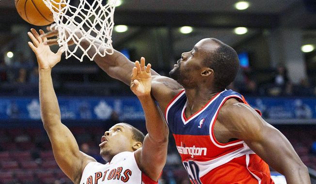 Emeka Okafor (right), a former Rookie of the Year, missed 39 games last season because of a knee injury, but he’s a viable option to start at center for the Wizards until Nene is healthy again. (Associated Press)