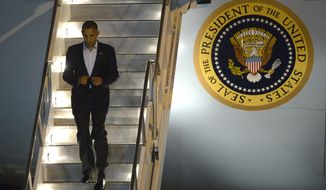 President Obama deplanes from Air Force One after arriving at Orlando International Airport in Orlando, Fla., on Sunday, Oct. 28, 2012. (AP Photo/Phelan M. Ebenhack)