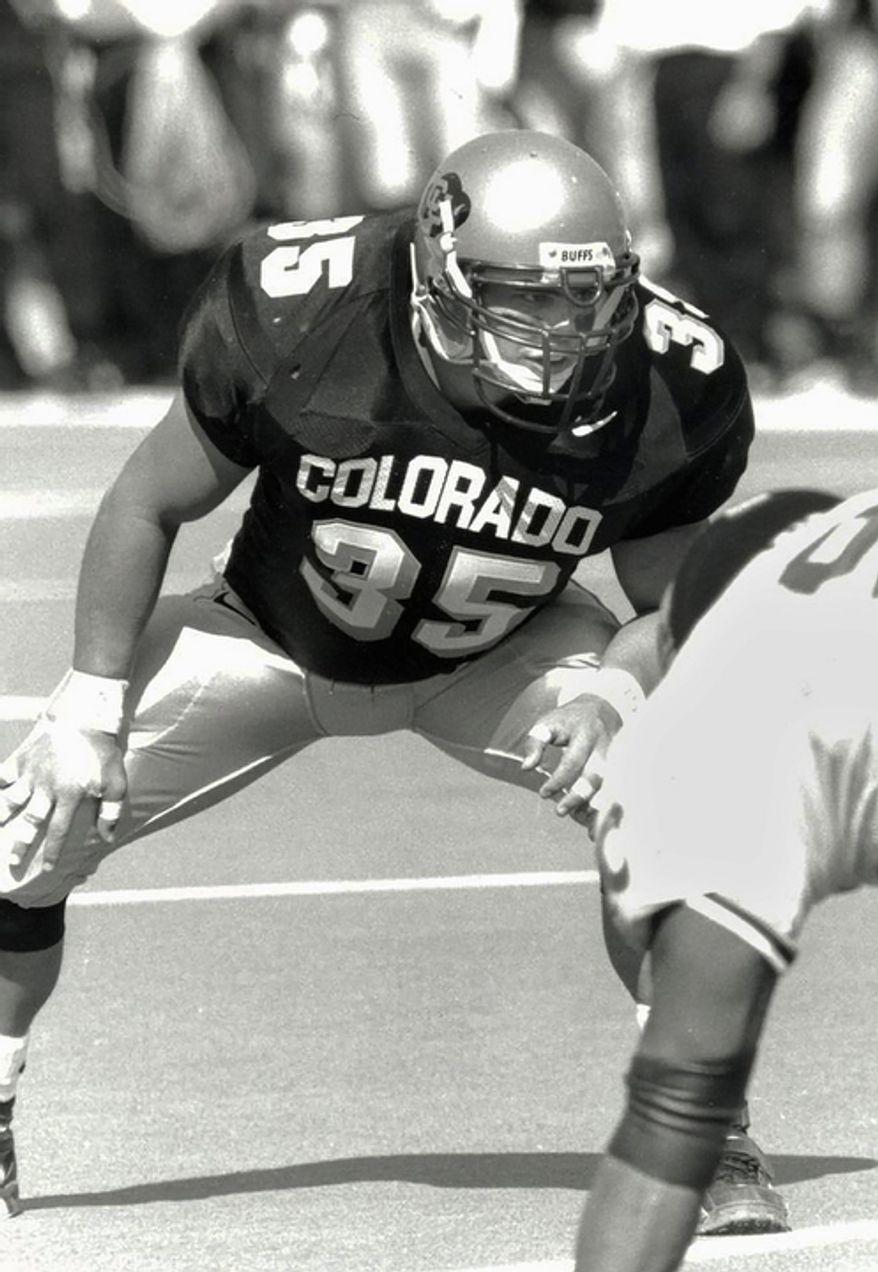 Keith Miller waits for the ball snap as a fullback for the school's NCAA college football team at the University of Colorado. Miller has reinvented himself, going from the gridiron to the stage and will appear in Verdi's "Un Ballo in Maschera," at the Metropolitan Opera in New York. (AP Photo/University of Colorado)