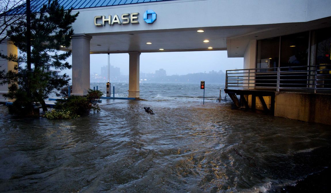 Rising water from the Hudson River overtakes a bank drive-through in Edgewater, N.J., Monday, Oct. 29, 2012, as Hurricane Sandy lashed the East Coast. (AP Photo/Craig Ruttle)

