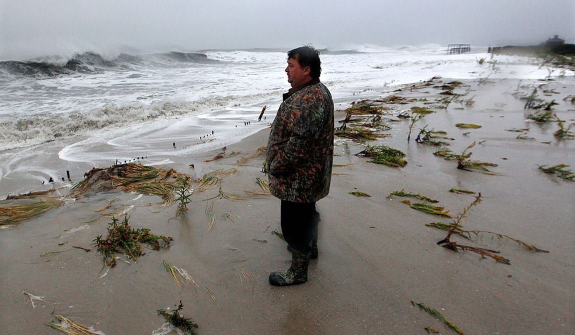 Lifelong Cape May resident Andy Becica watches rough surf pound the beach on Monday morning, Oct. 29, 2012, in Cape May, N.J., as high tide and Hurricane Sandy begin to arrive. Mr. Becica said this was the worst he&#x27;s seen the ocean. Hurricane Sandy continued on its path Monday, forcing the shutdown of mass transit, schools and financial markets; sending coastal residents fleeing; and threatening a dangerous mix of high winds and soaking rain.  (AP Photo/Mel Evans)