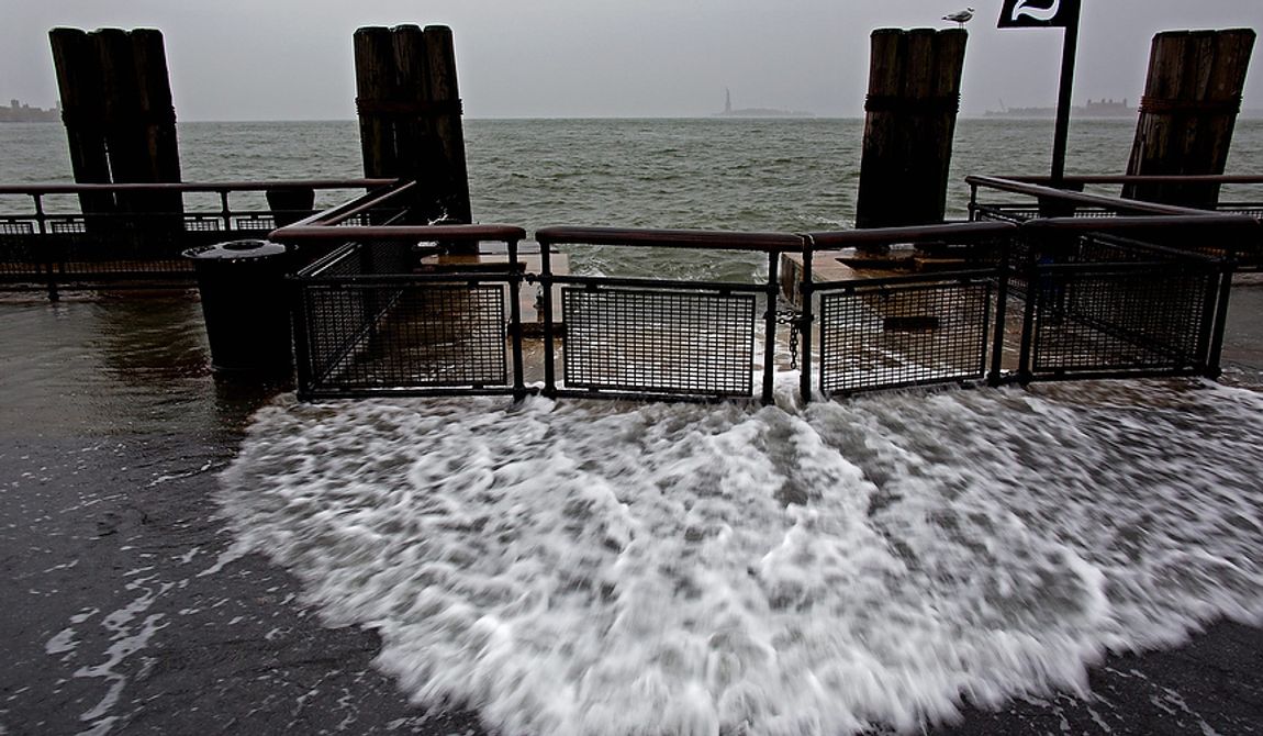 Waves wash over the seawall near high tide at Battery Park in New York on Monday, Oct. 29, 2012, as Hurricane Sandy approaches the East Coast. Hurricane Sandy continued on its path Monday, forcing the shutdown of mass transit, schools and financial markets; sending coastal residents fleeing; and threatening a dangerous mix of high winds and soaking rain. (AP Photo/Craig Ruttle)