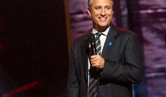 ** FILE ** Comedian and TV host Jon Stewart appears onstage at Comedy Central&#39;s &quot;Night of Too Many Stars&quot; event at the Beacon Theatre in New York on Oct. 2, 2010. (AP Photo/Charles Sykes)

