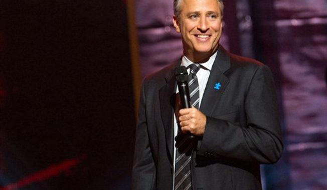 ** FILE ** Comedian and TV host Jon Stewart appears onstage at Comedy Central&#x27;s &quot;Night of Too Many Stars&quot; event at the Beacon Theatre in New York on Oct. 2, 2010. (AP Photo/Charles Sykes)

