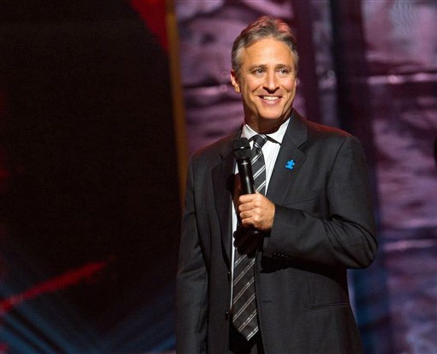 ** FILE ** Comedian and TV host Jon Stewart appears onstage at Comedy Central's "Night of Too Many Stars" event at the Beacon Theatre in New York on Oct. 2, 2010. (AP Photo/Charles Sykes)