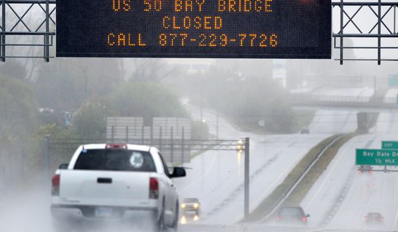 A sign informs motorists along U.S. Route 50 that Maryland&#39;s Chesapeake Bay Bridge, which connects the state&#39;s eastern and western shores, is closed because of winds from Hurricane Sandy Monday, Oct. 29, 2012.  (AP Photo/Steve Ruark)