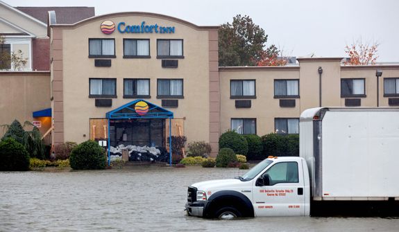 Water from the Hudson River surrounds a hotel in Edgewater, N.J., Monday, Oct. 29, 2012 as Hurricane Sandy lashes the East Coast. (AP Photo/Craig Ruttle)
