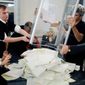 A local election commission opens a ballot box Sunday to count votes from Sunday’s parliamentary elections at a polling station in Kiev, Ukraine. Secretary of State Hillary Rodham Clinton said the vote amid charges of election fraud are “a step backward for Ukranian democracy.” (Associated Press)