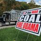 A truck passes a political sign in a yard in Dellslow, W.Va., on Oct. 16, 2012. (AP Photo/Vicki Smith) ** FILE **