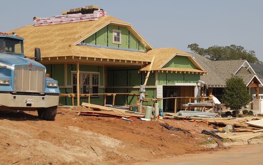 A new home is under construction in Edmond, Okla., on Friday, Sept. 21, 2012. (AP Photo/Sue Ogrocki)