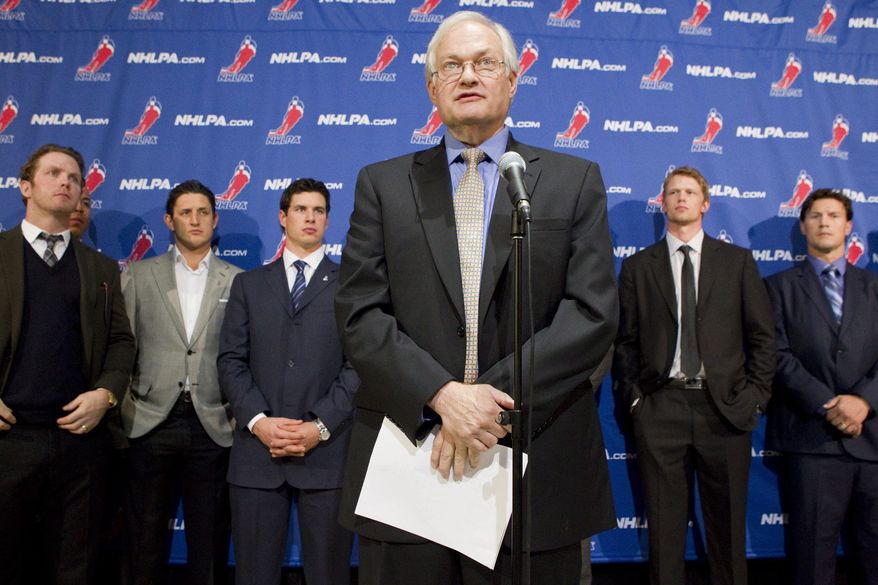 Donald Fehr, left, executive director of the NHL players' association, talks to reporters following collective bargaining talks between the NHLPA and the NHL in Toronto on Thursday, Oct. 18, 2012. Players, from left, Detroit Red Wings' Daniel Cleary, Edmonton Oilers' Shawn Horcoff, Pittsburgh Penguins' Sidney Crosby, Carolina Hurricanes' Eric Staal and Phoenix Coyotes' Shane Doan listen in the background. (AP Photo/The Canadian Press, Chris Young)
