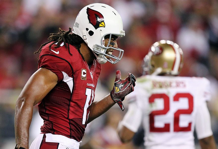 Arizona Cardinals wide receiver Larry Fitzgerald (11) reacts to a missed pass against the San Francisco 49ers during the second half of an NFL football game on Monday, Oct. 29, 2012, in Glendale, Ariz. The 49ers won 24-3. (AP Photo/Paul Connors)
