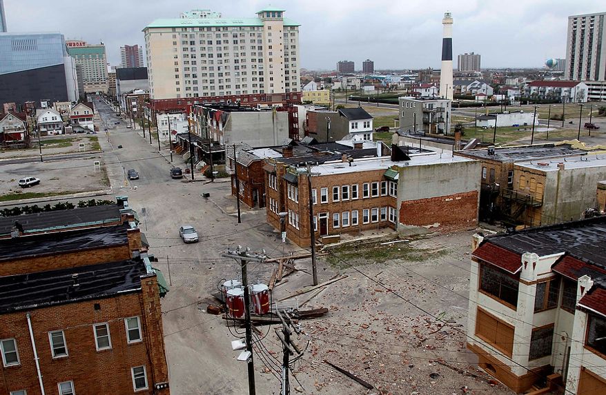 Sand and debris covers the streets near the water in Atlantic City, N.J., Tuesday, Oct. 30, 2012. Sandy, the storm which was downgraded from a hurricane just before making landfall, caused multiple fatalities, halted mass transit and cut power to more than 6 million homes and businesses. (AP Photo/Seth Wenig)