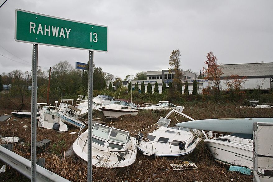 Pleasure boats pile up 30 yards or more from the waterís edge in the wake of Hurricane Sandy, Tuesday, Oct. 30, 2012, in the Cliffwood Beach section of Aberdeen, N.J. The storm's high winds and the high astronomical tide paired up to rip the boats away from their dock and deposit them on shore. (AP Photo/Peter Hermann, III)