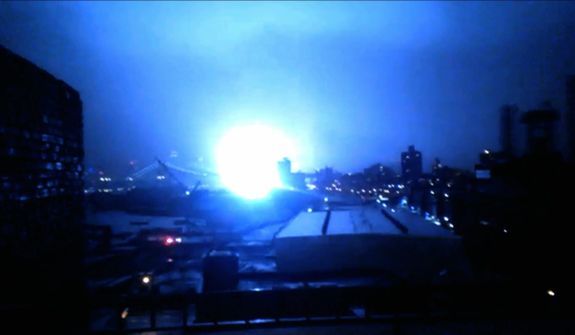 This image from video provided by Dani Hart shows what appears to be a transformer exploding in lower Manhattan as seen from a building rooftop from the Navy Yard in Brooklyn during Sandy’s arrival in New York City. Much of New York was plunged into darkness Monday by a superstorm that overflowed the city&#39;s historic waterfront, flooded the financial district and subway tunnels and cut power to nearly a million people. (AP Photo/Dani Hart)
