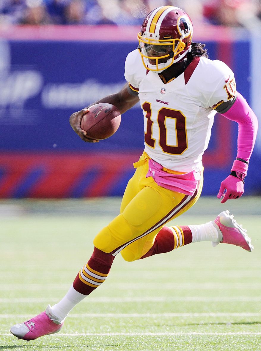 Washington Redskins quarterback Robert Griffin III (10) scrambles during third quarter action at MetLife Stadium, East Rutherford, N.J., Oct. 21, 2012. (Preston Keres/Special to The Washington Times)