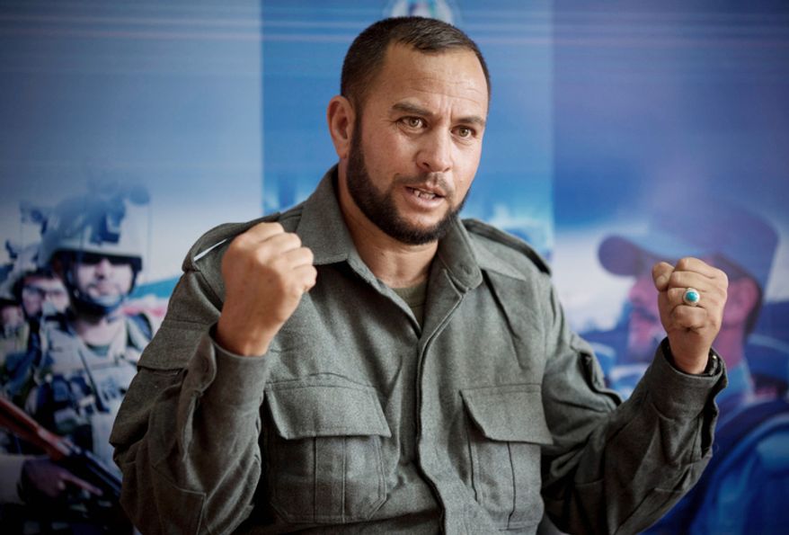 Seven veteran with the Afghan National Police, Zalmai Faizi, from Ghazni province, talks in Kabul, Afghanistan about his children. Earlier this October, Faizi buried his 5-year-old daughter, Ennah, and 18-year-old son, Zalkai. Taliban roared up to his home on two motorcycles, spraying his police car with bullets, killing them both. (AP Photo/Anja Niedringhaus)