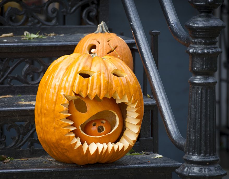 Decorated pumpkins sit on the steps of a home on North Carolina Avenue SE in Washington, D.C., Wednesday, Oct. 31, 2012. (Rod Lamkey Jr./The Washington Times)