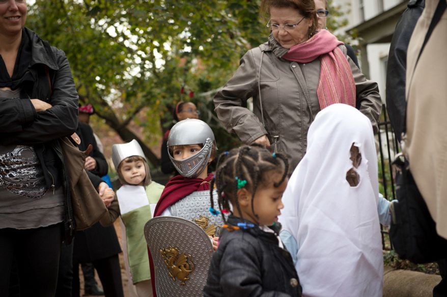 Kids from the AppleTree Early Learning Public Charter School Lincoln Park Campus take part in their Halloween parade in Washington, D.C., Wednesday, Oct. 31, 2012. (Rod Lamkey Jr./The Washington Times)