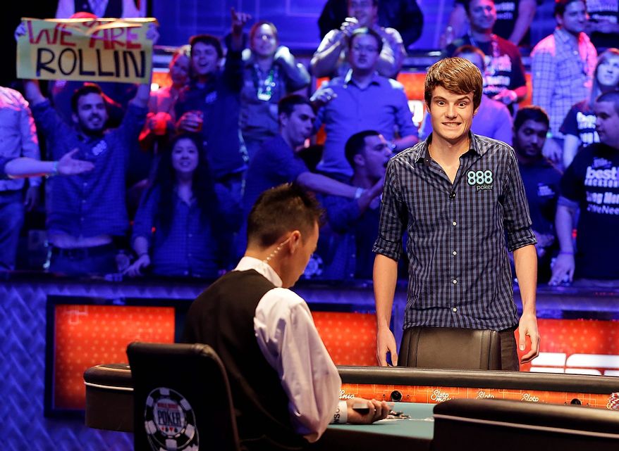 Jake Balsiger watches the flop after an all-in bet during the World Series of Poker Final Table event, Tuesday, Oct. 30, 2012, in Las Vegas. Balsiger won the hand and spiked his double. (AP Photo/Julie Jacobson)