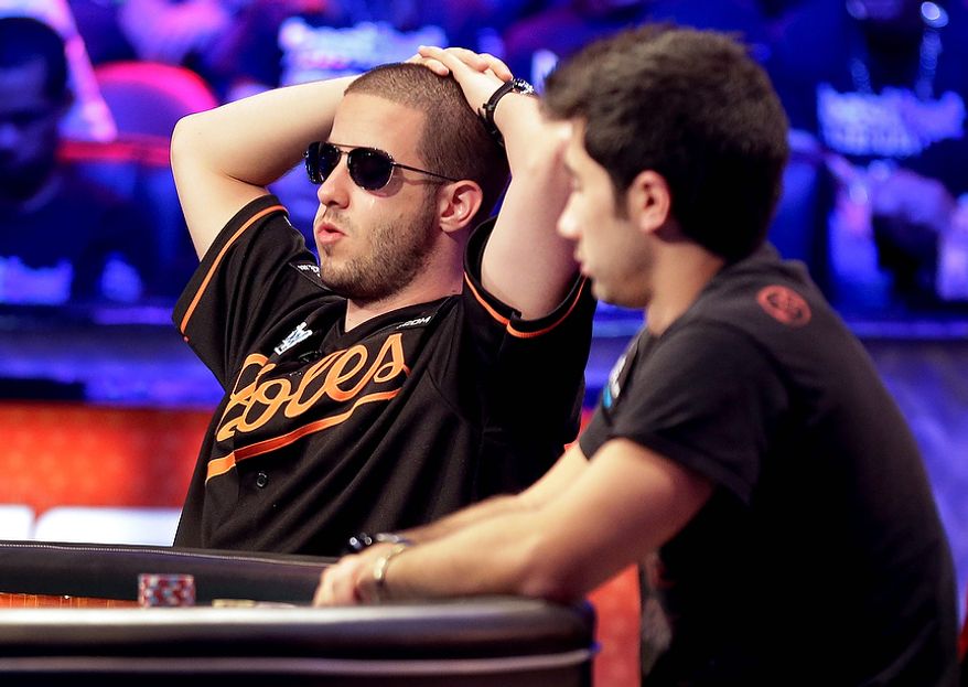 Greg Merson, left, and Jesse Sylvia watch play during the World Series of Poker Final Table event, Tuesday, Oct. 30, 2012, in Las Vegas. (AP Photo/Julie Jacobson)