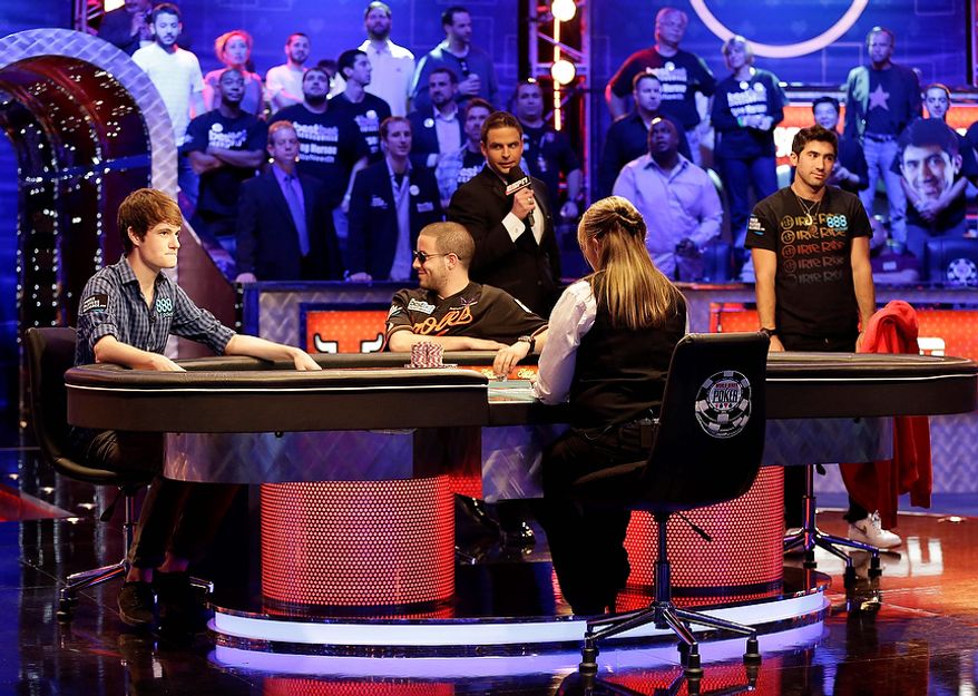 From left, Jake Balsiger, Greg Merson, and Jesse Sylvia watch the flop after Balsiger bet all in on a hand during the World Series of Poker Final Table event, Tuesday, Oct. 30, 2012, in Las Vegas. Balsiger won the pot on the hand. (AP Photo/Julie Jacobson)
