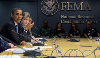** FILE ** President Barack Obama, accompanied by Homeland Security Secretary Janet Napolitano, second from left, and others, speaks about superstorm Sandy during a visit to the Federal Emergency Management Agency (FEMA) Headquarters in Washington, Wednesday, Oct. 31, 2012. (AP Photo/Carolyn Kaster)