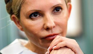** FILE ** In this Monday, April 4, 2011, photo, Yulia Tymoshenko, former Ukrainian prime minister and main opposition leader, is pictured in her headquarters in Kiev. Tymoshenko&#39;s party alleged widespread elections violations, such as vote-buying and multiple voting, and the jailed leader, who is currently undergoing treatment for a back problem in a Ukrainian hospital, launched a hunger strike in protest. (AP Photo/Efrem Lukatsky)