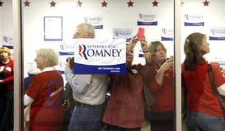 Fans and volunteers await the arrival of Ann Romney, wife of Republican presidential candidate Mitt Romney, at the Romney for Ohio Headquarters in Grandview Heights, Ohio on Wednesday, Oct. 31, 2012. (AP Photo/Columbus Dispatch, Brooke LaValley)