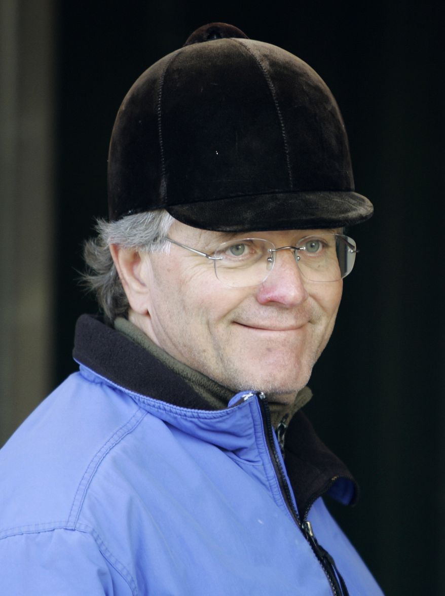 FILE - In this April 27, 2008, file photo, horse trainer Bill Mott smiles while waiting at his barn at Churchill Downs in Louisville, Ky. Mott is in position to duplicate the ultimate daily double. The Hall of Fame trainer swept the $2 million Ladies' Classic and $5 million Classic at last year's Breeders' Cup. He could do it again this weekend, with Royal Delta defending her Ladies' title and three of his horses running in the big race. (AP Photo/Ed Reinke, File)