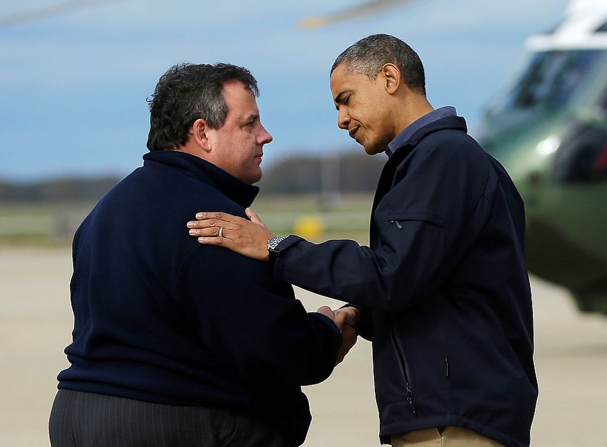 President Obama (right) is greeted by New Jersey Gov. Chris Christie upon the president&#39;s arrival at Atlantic City International Airport on Wednesday, Oct. 31, 2012, near Atlantic City, N.J. Mr. Obama traveled to the region to take an aerial tour of the New Jersey coastline damaged by Superstorm Sandy. (AP Photo/Pablo Martinez Monsivais)