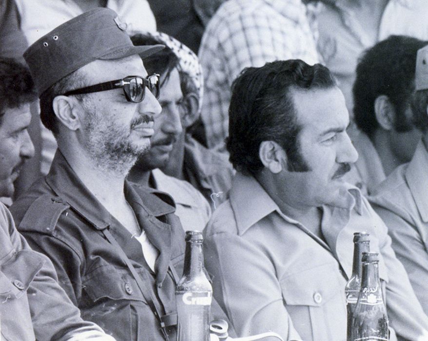 ** FILE ** Palestinian leader Yasser Arafat (left) and his deputy, Abu Jihad, whose nom de guerre was Abu Jihad, are shown in an undated image. (AP Photo/Palestinian Authority)