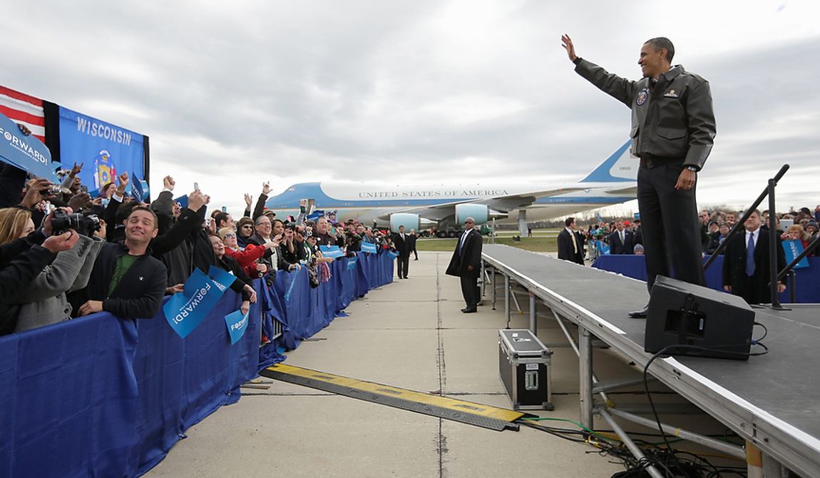 President Obama waves to supporters during a campaign event at Austin Straubel International Airport in Green Bay, Wis., on Thursday, Nov. 1, 2012. Mr. Obama resumed his presidential campaign with travel to the key battleground states of Wisconsin, Colorado, Nevada and Ohio today. (AP Photo/Pablo Martinez Monsivais)