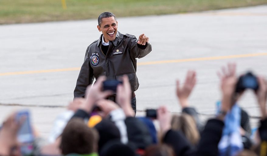 President Obama waves to supporters upon his arrival in Green Bay, Wis., on Thursday, Nov. 1, 2012, for a quick campaign stop before heading to Las Vegas. (AP Photo/Tom Lynn)