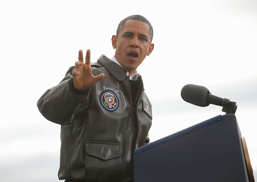 President Obama gestures while speaking at a campaign event at Austin Straubel International Airport in Green Bay, Wis., on Thursday, Nov. 1, 2012. Mr. Obama resumed his presidential campaign with travel to the key battleground states of Wisconsin, Colorado, Nevada and Ohio today. (AP Photo/Pablo Martinez Monsivais)