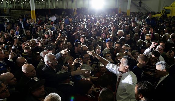 Republican presidential candidate, former Massachusetts Gov. Mitt Romney greets supporters as he campaigns at Integrity Windows in Roanoke, Va., Thursday, Nov. 1, 2012. (AP Photo/Charles Dharapak)