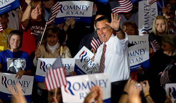 Republican presidential candidate, former Massachusetts Gov. Mitt Romney waves as he takes the stage for a campaign event at a window and door factory, Thursday, Nov. 1, 2012, in Roanoke, Va. (AP Photo/David Goldman)
