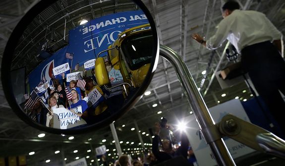 Supporters are reflected in a truck&#39;s mirror as Republican presidential candidate, former Massachusetts Gov. Mitt Romney campaigns at Integrity Windows in Roanoke, Va., Thursday, Nov. 1, 2012. (AP Photo/Charles Dharapak)